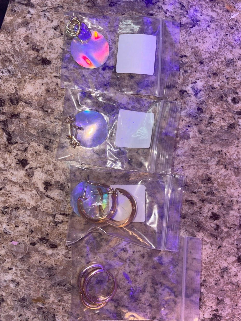 Set of 3 gold earrings & a charm